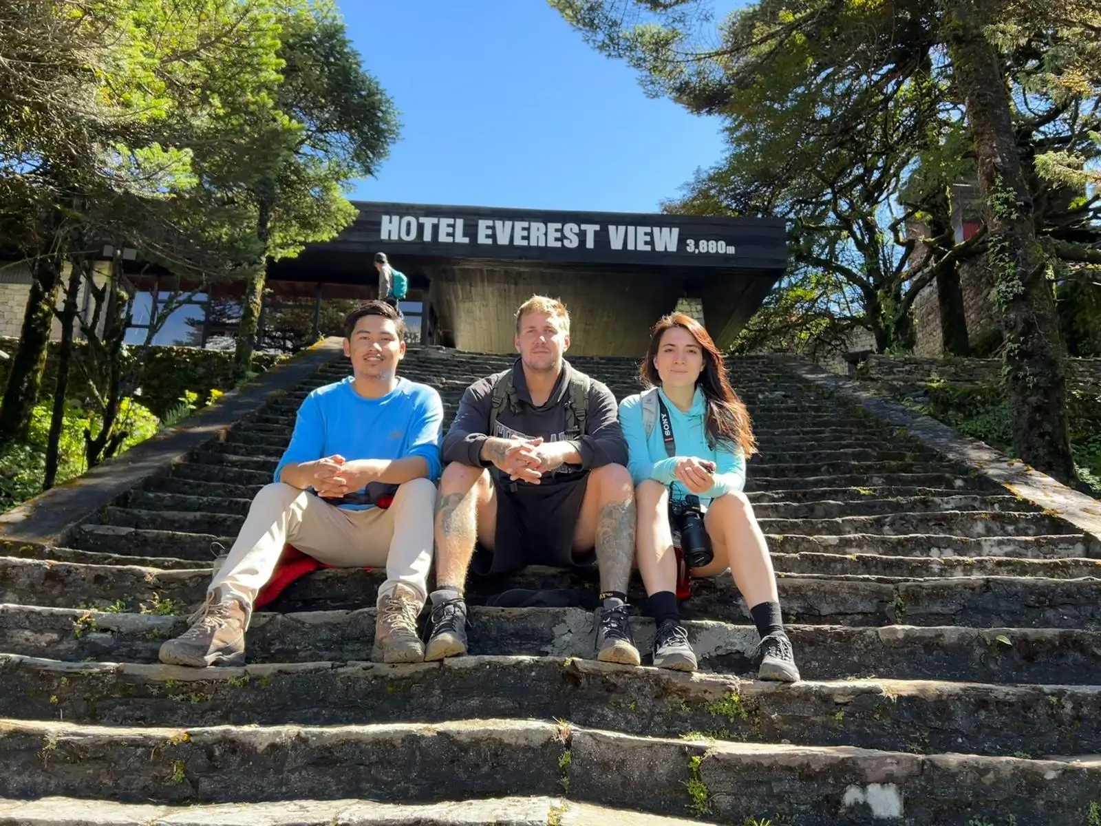 Elysian Quest Guest and Team seatinf on stairs of Everest View Hotel